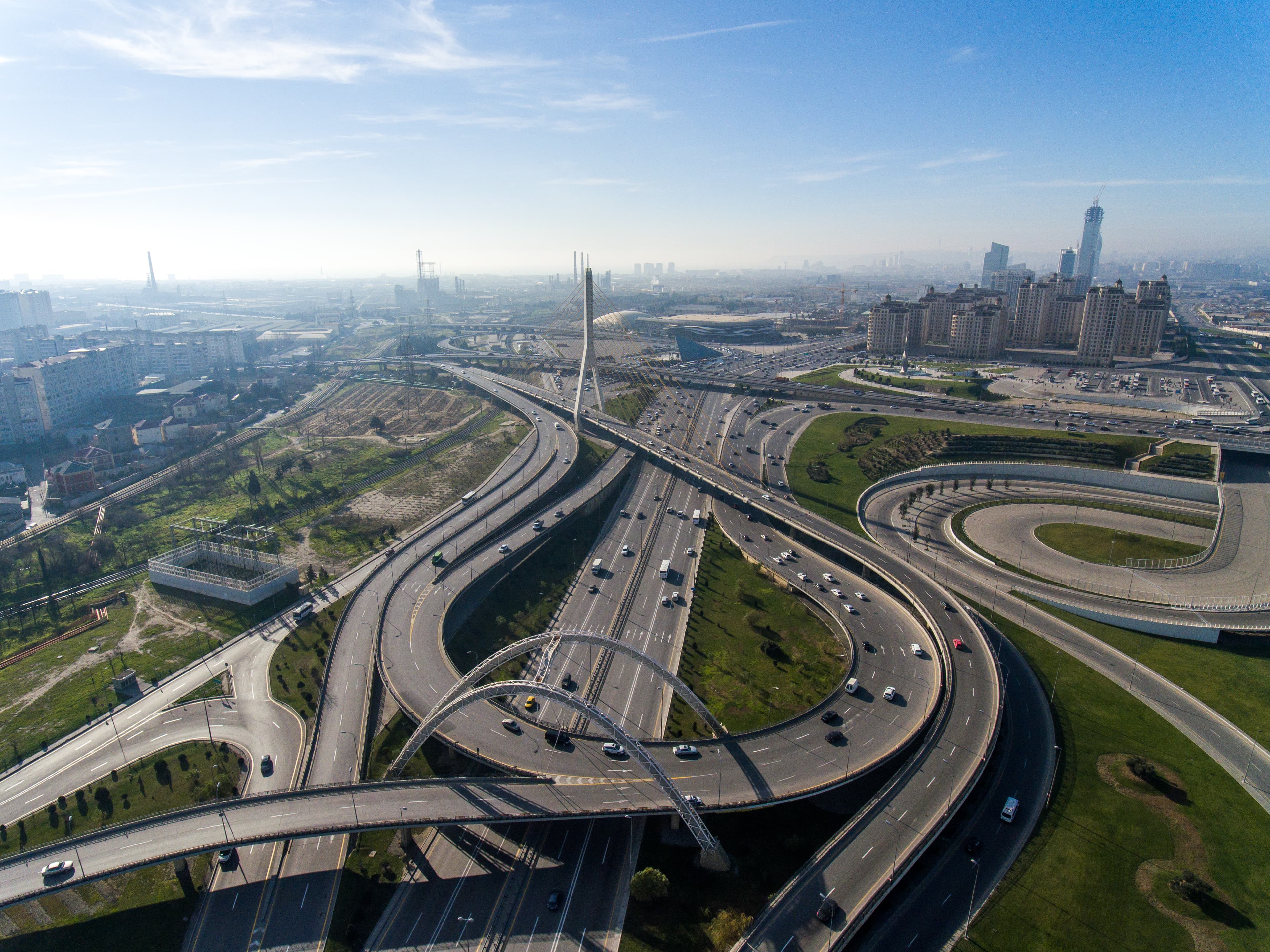 Aerial view of a U.S. highway interchange at sunset — the infrastructure Metro Associates staffs